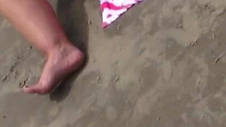 Wife masturbates on beach