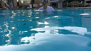 Couple Underwater Diving and Swimming