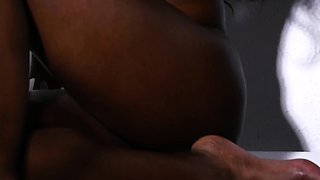 Slender petite ebony MILF strips naked