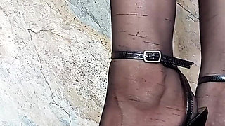 In Front of You the Secretary with Pantyhose and Stiletto Heels Dangling From Her Feet