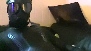 In tight wetsuit and gasmask