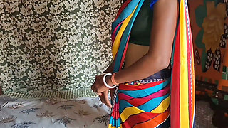 Auntie, clad in a red saree, approaches creating a beautiful and romantic moment filled with love anal sex