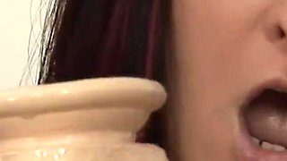 Massive perfect babe pushes big dildo up her cunt