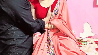 Hot Indian bhabhi in red saree gets seduced in a corner