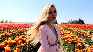 Blonde is flashing her big boobs in the outdoors