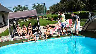A group of sexy chicks are having a pool party with banging