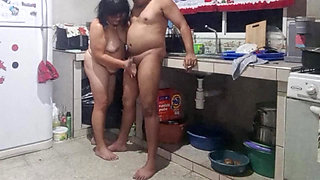 My mother-in-law masturbates me in the kitchen and wants me to fuck her doggy style.