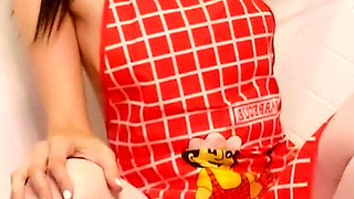 Hot housewife sexually rustles her apron in the kitchen