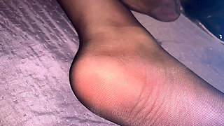 Feet in black pantyhose to jerk off and cum