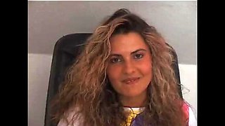 Gorgeous curly haired babe shows off her round ass and masturbates solo on camera