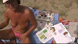 mature voyeur masturbates and sucks on beach