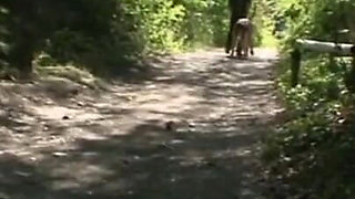 Humiliating whipping kneeling on the lake shore