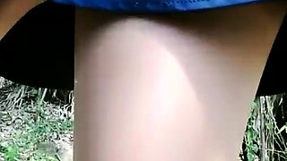 Asian amateur gives outdoor blowjob